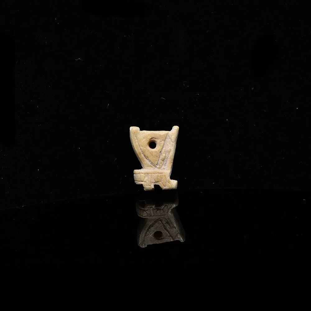 An Egyptian Bone 'Red Crown' Amulet, Late Period, ca. 664 - 332 BCE