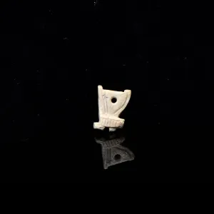 An Egyptian Bone 'Red Crown' Amulet, Late Period, ca. 664 - 332 BCE