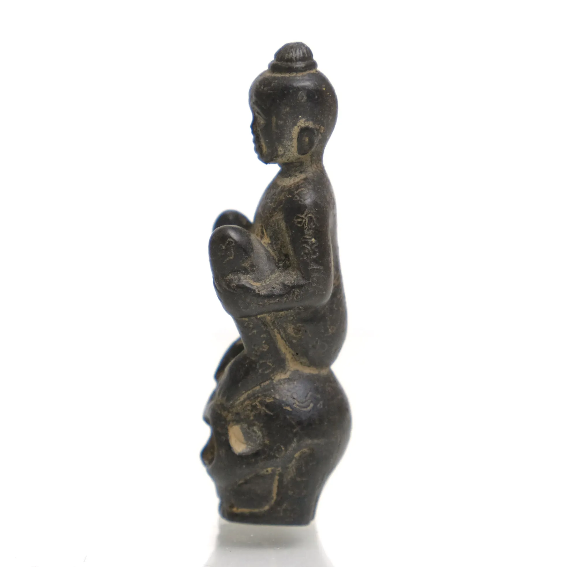 Kuman Thong Resting on a Skull Amulet